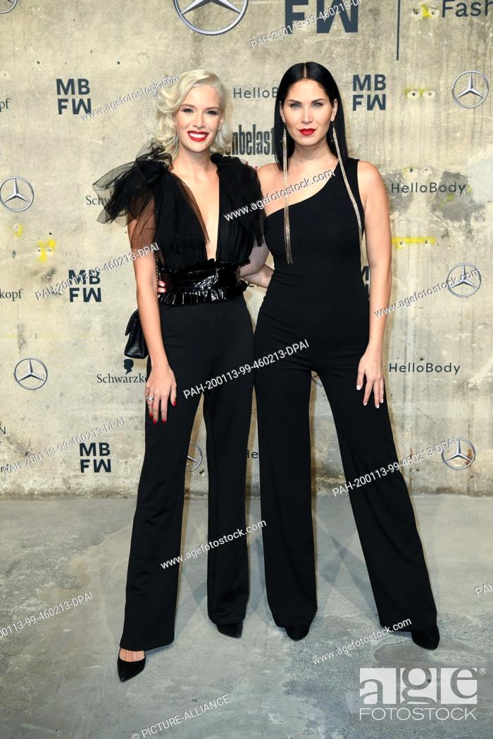 Stock Photo: 13 January 2020, Berlin: Nadia Al-Mardini (r) and Oksana Kolesnichenko come to the show of ""Fashion Talents from South Africa"" on the opening evening of the.