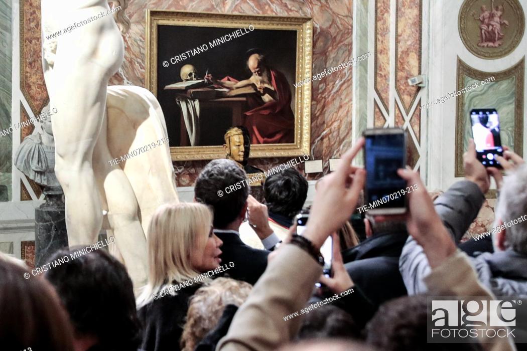 Stock Photo: The artist Liu Bolin for the celebration of the Chinese new year portrays himself near the painting ' Saint Gerolamo' by Caravaggio in the Borghese Gallery in.