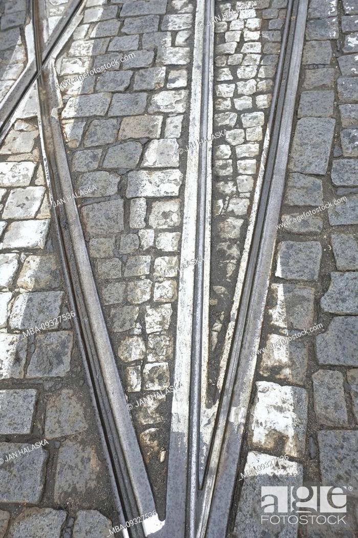 Stock Photo: Street car rails coming together near the switch on marked crosswalk. Prague, Czech Republic.