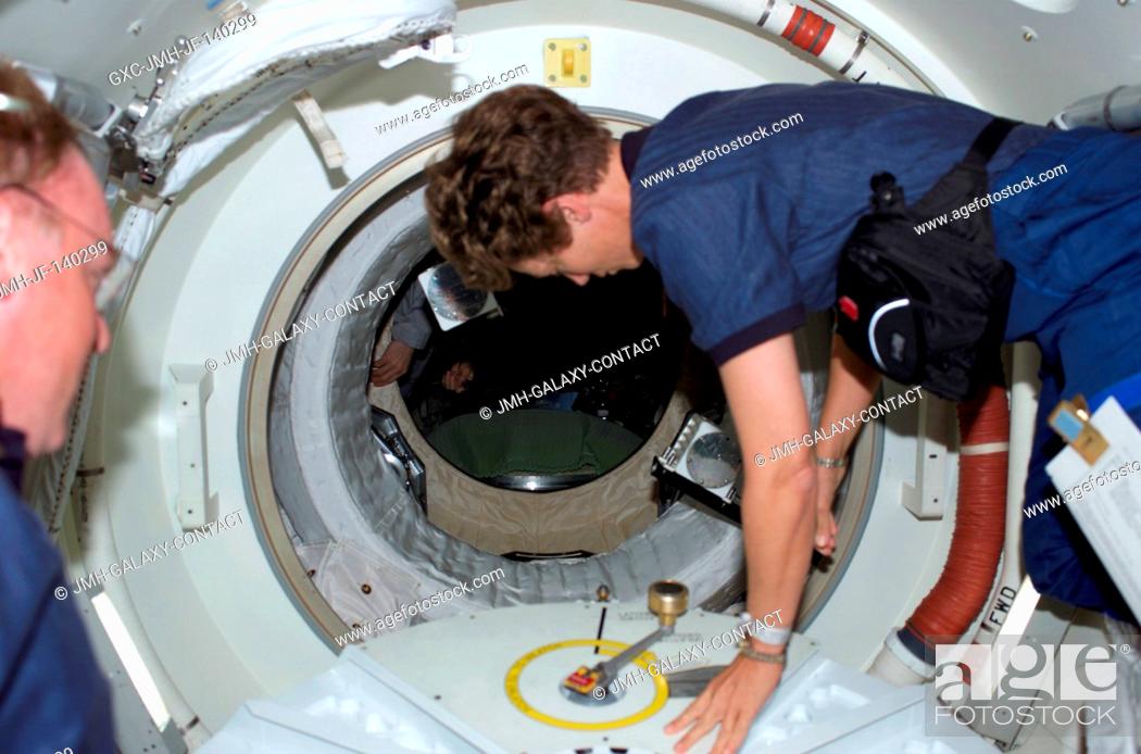 Stock Photo: Astronaut Eileen M. Collins, STS-114 commander, has just opened the hatch that will lead her and the entire Discovery crew into the International Space Station.
