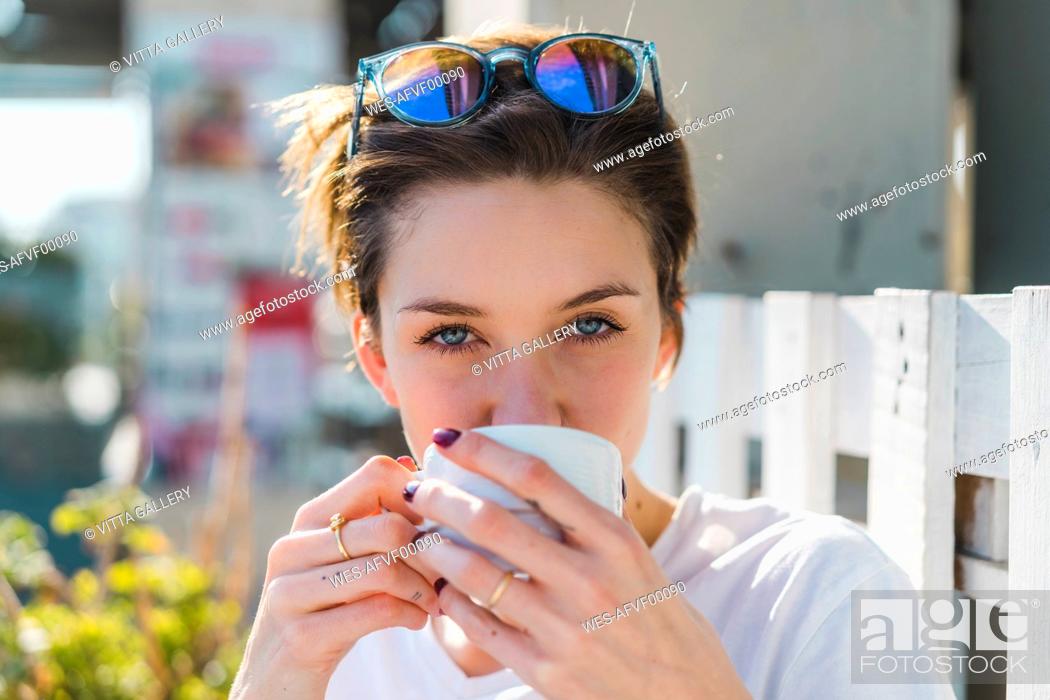 Stock Photo: Portrait of woman drinking cup of coffee.