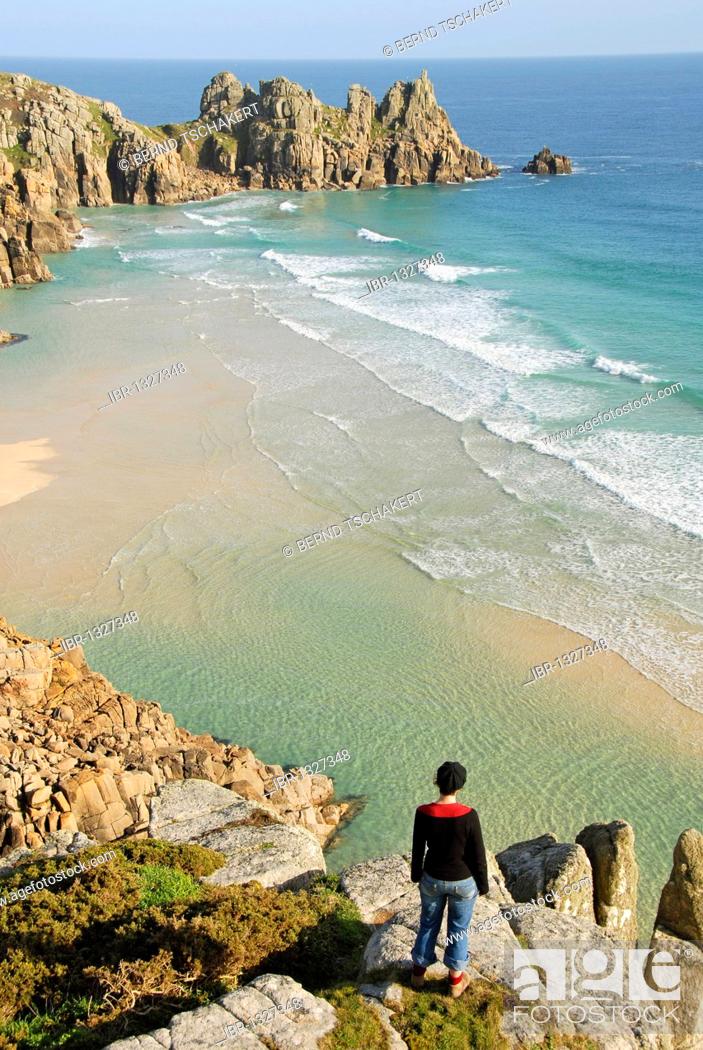 Stock Photo: Women looking at waves and the beach, lookout, Porthcurno Beach, Pedn Vounder Beach, Logan Rock, South Coast, Cornwall, England, United Kingdom, Europe.