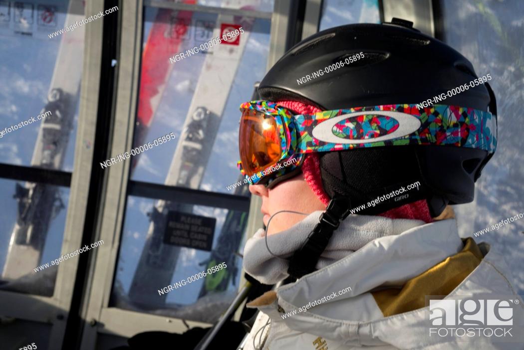 Stock Photo: Skier with ski goggles and helmet on the chairlift, Kicking Horse Mountain Resort, Golden, British Columbia, Canada.