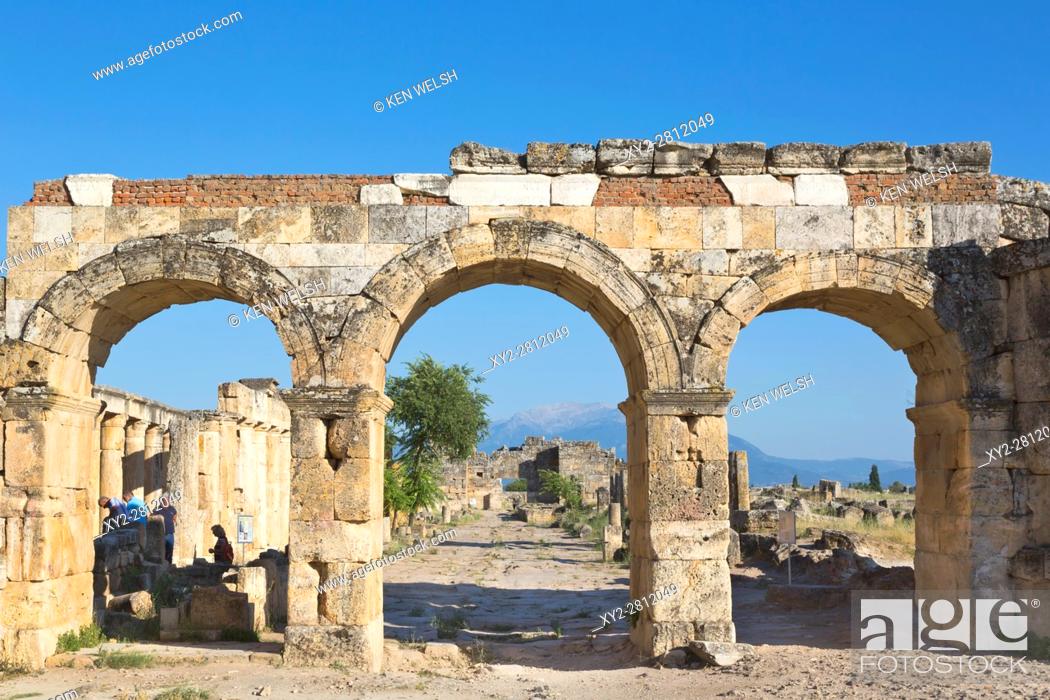 Stock Photo: Hierapolis, Denizli Province, Turkey. Ruins of the ancient city. The northern Roman Gate, also known as the Domitian Gate, or Domitian Arch.