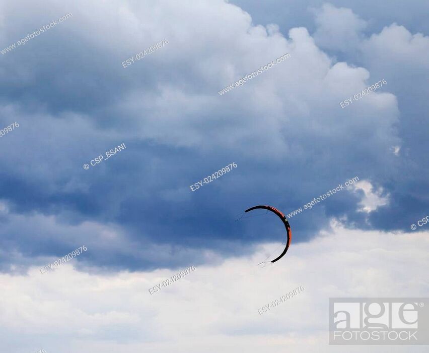 Stock Photo: Power kite in sea and cloudy sky.