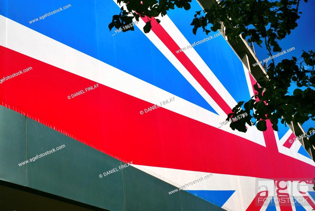 Stock Photo: Union Jack facade of the John Lewis department store on Oxford Street, during the Olympics 2012 season in London, England  It is a sunny day.