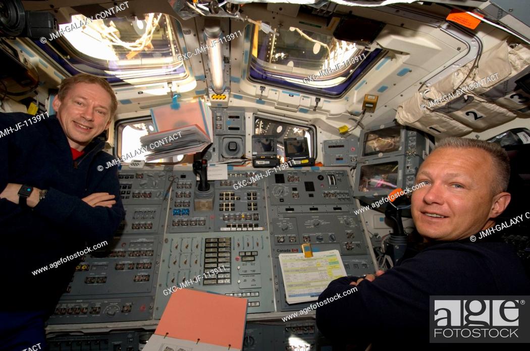 Stock Photo: European Space Agency astronaut Frank De Winne (left), Expedition 20 flight engineer, and Doug Hurley, STS-127 pilot, are pictured at Endeavour's aft flight.