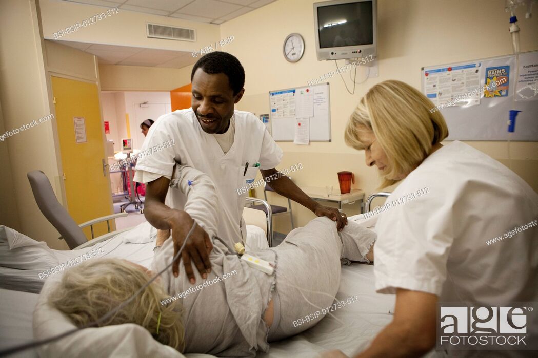 Stock Photo: Photo essay at La Croix Saint-Simon Hospital, Paris, France. Night shift nurse and ancillary hospital staff.