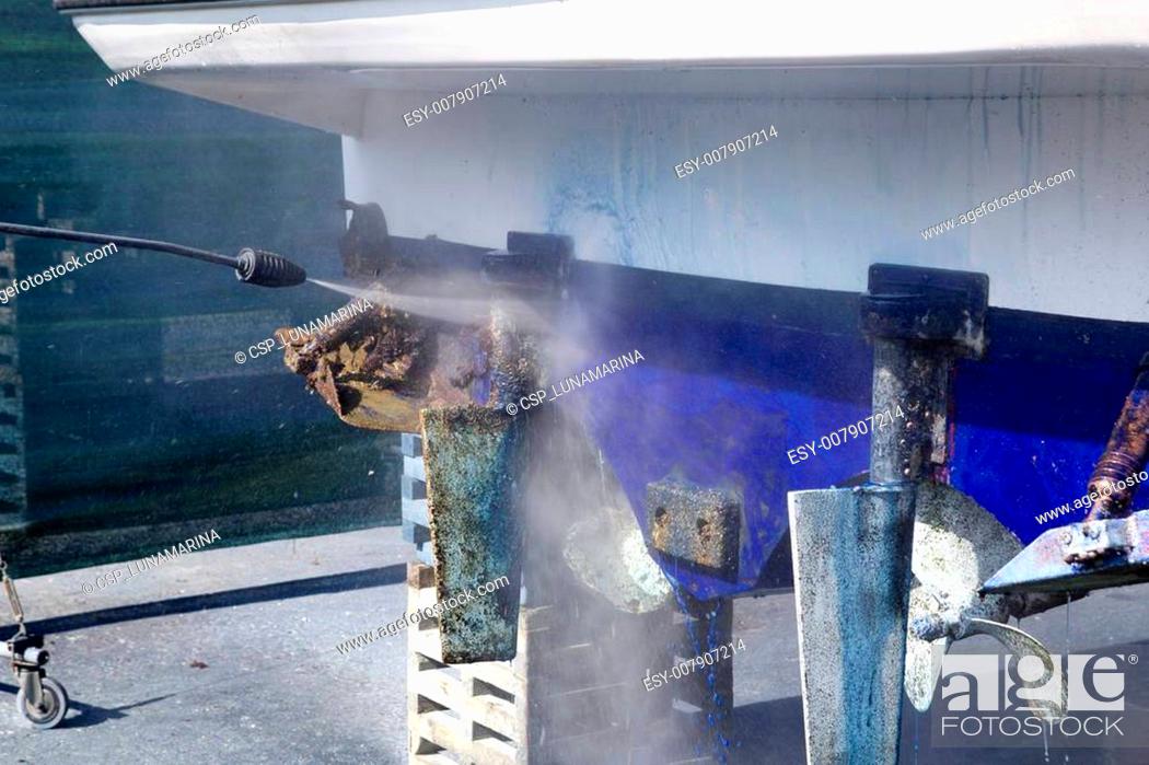 Stock Photo: Boat hull cleaning water pressure washer.