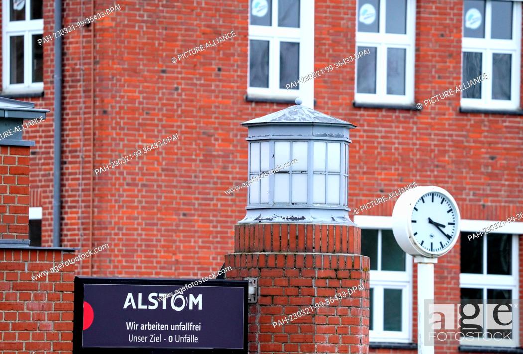 Stock Photo: 21 March 2023, Brandenburg, Hennigsdorf: At the main entrance to rail vehicle manufacturer Alstom, a sign reads ""We work accident-free"".