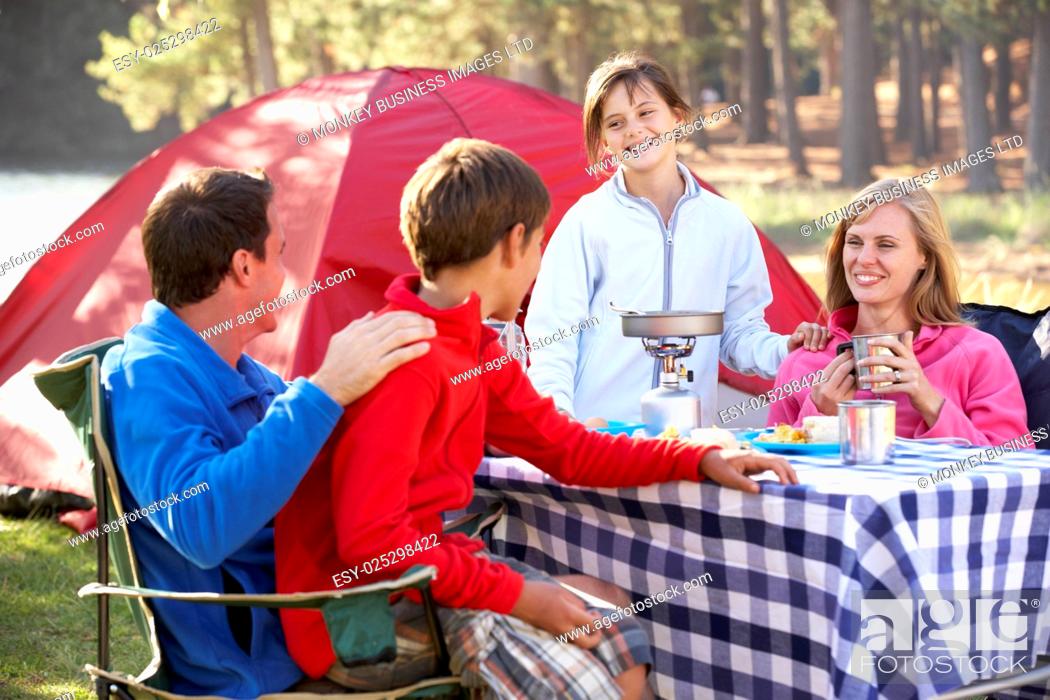 Stock Photo: Family Enjoying Meal On Camping Holiday.