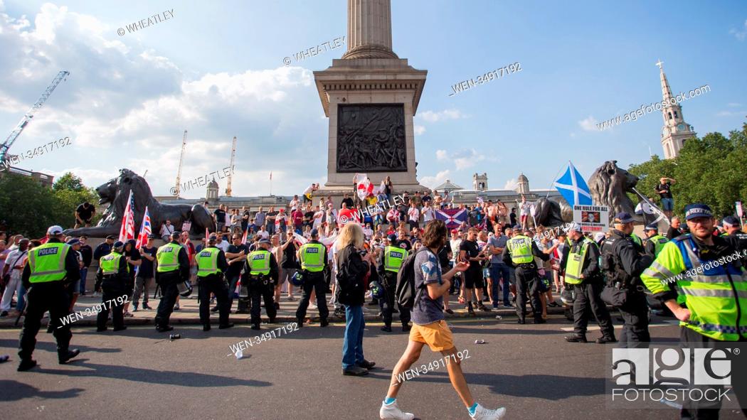 Stock Photo: Supporters of jailed EDL founder Tommy Robinson bring traffic to a halt in London's Trafalgar Square following rally earlier in the day on Whitehall.