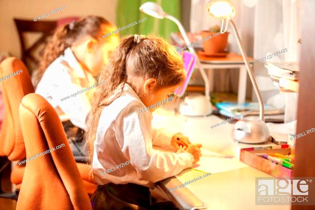 Little Girls Drawing Pictures Behind Desk Stock Photo Picture And Low Budget Royalty Free Image Pic Esy 021874429 Agefotostock