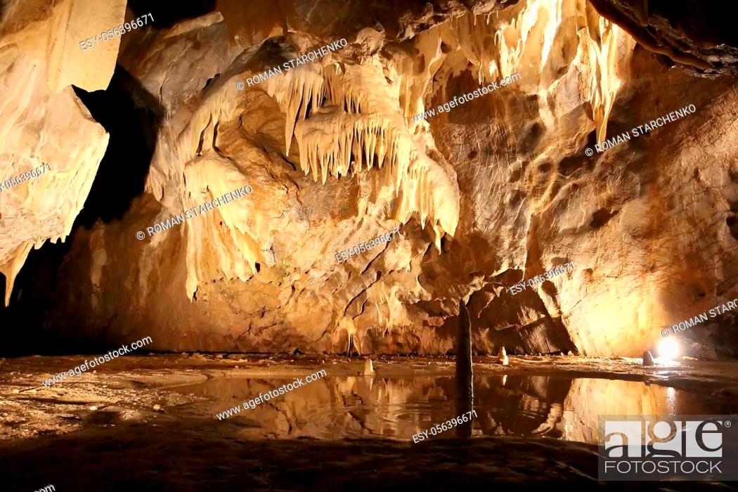 Stock Photo: Cave with stalactites and stalagmites. Geological formation karst. Karst cave.