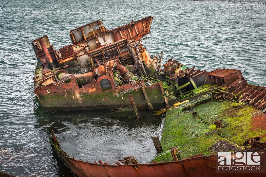 Stock Photo: A boat run aground and stripped of all recoverable fixtures and fittings. Gaansbaai Goose Bay, Western Cape Province, South Africa..