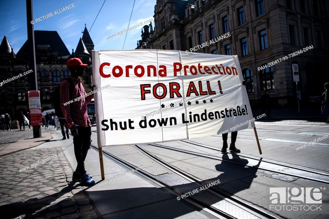 Stock Photo: 17 April 2020, Bremen: Demonstrators hold a poster saying ""Corona Protection for all!"". During a demonstration, the closure of the central initial reception.