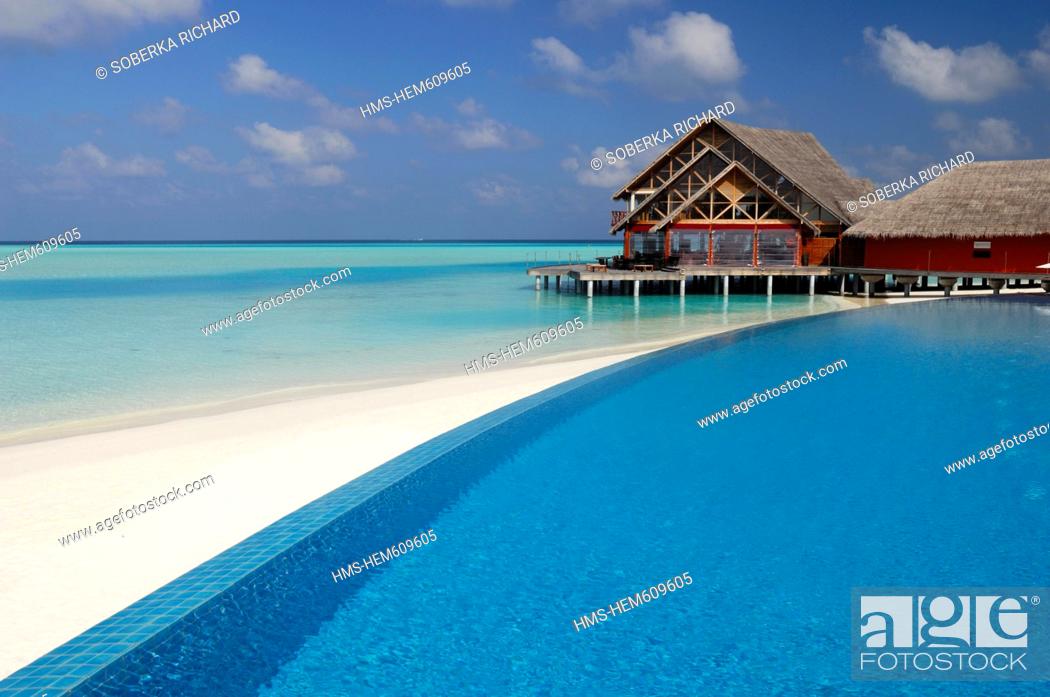 Stock Photo: Maldives, South Male Atoll, Dhigu Island, Anantara Resort and Spa Hotel, swimming pool and white sand beach overlooked by a restaurant on stilts in the lagoon.