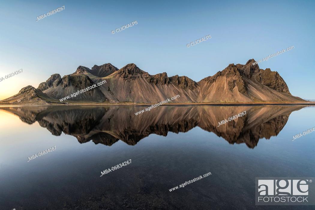 Stock Photo: Stokksnes, Hofn, Eastern Iceland, Iceland. Vestrahorn mountain mirrors in the waters of the Stokksnes bay.