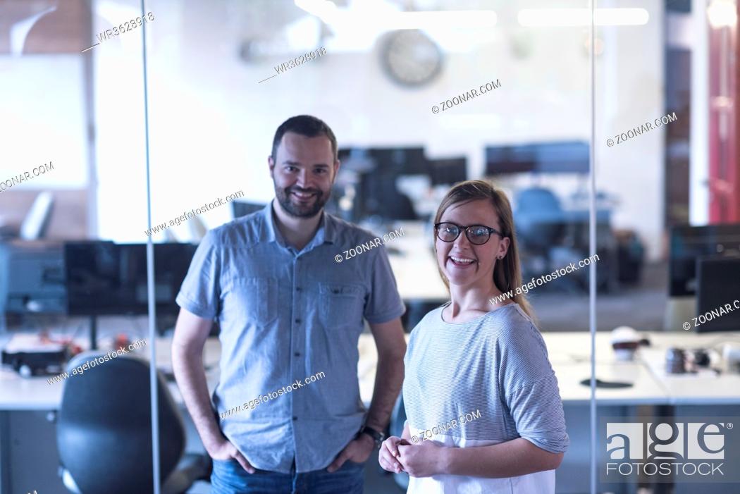 Stock Photo: business couple working together on project at modern startup office.
