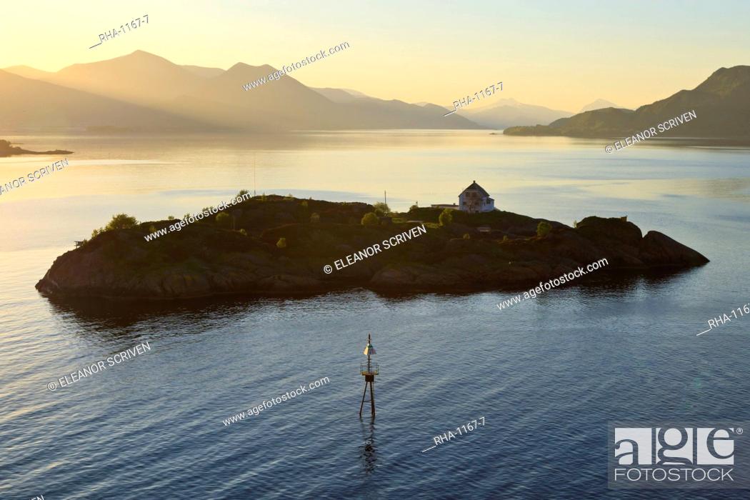 Stock Photo: Islet with house lit by shafts of sunlight at dawn, entrance to Romsdalsfjord, Norway, Scandinavia, Europe.