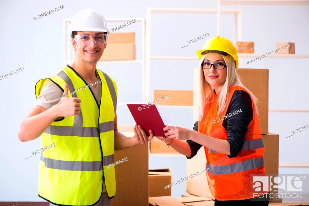 Stock Photo: Delivery contractor delivering boxes to office.