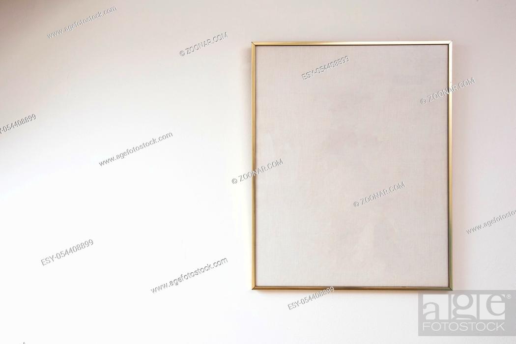 Stock Photo: Blank painting on white wall with golden frame, space for text beauty.