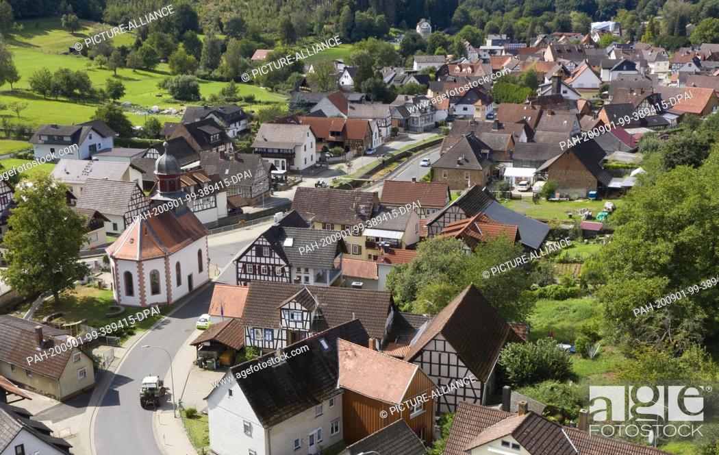 Stock Photo: 01 September 2020, Hessen, Bergheim: The center of Bergheim near Ortenberg in the Wetterau (aerial view with a drone). According to a local inhabitant.