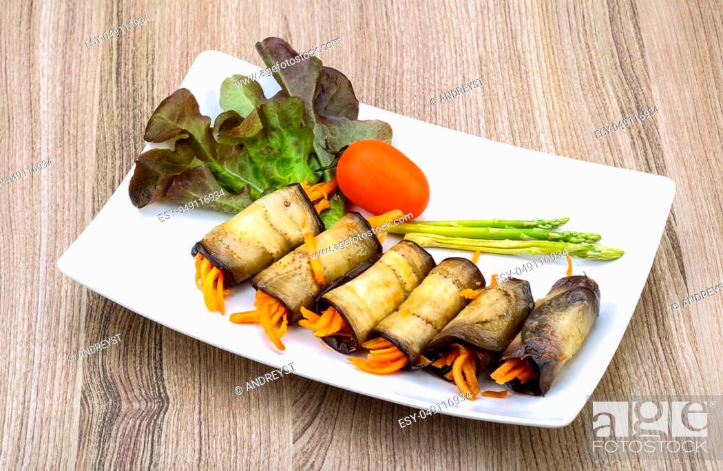 Stock Photo: Eggplant rolls with carrot served spices and coriander.