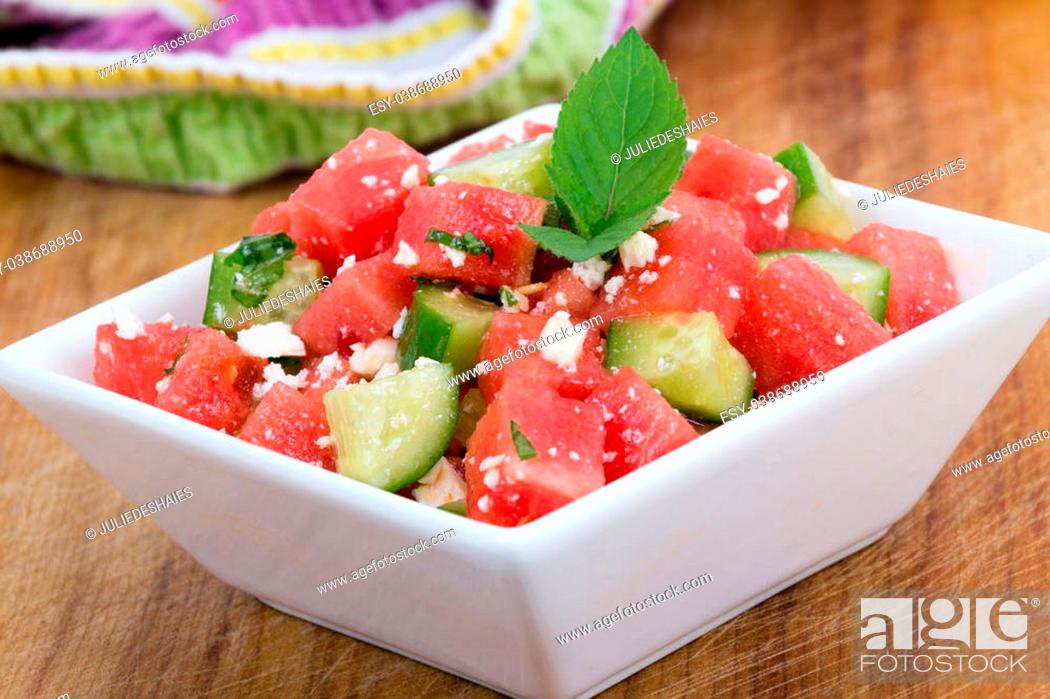 Stock Photo: Healthy Fresh Organic Watermelon Salad with Mint, feta cheese and Cucumber closeup.