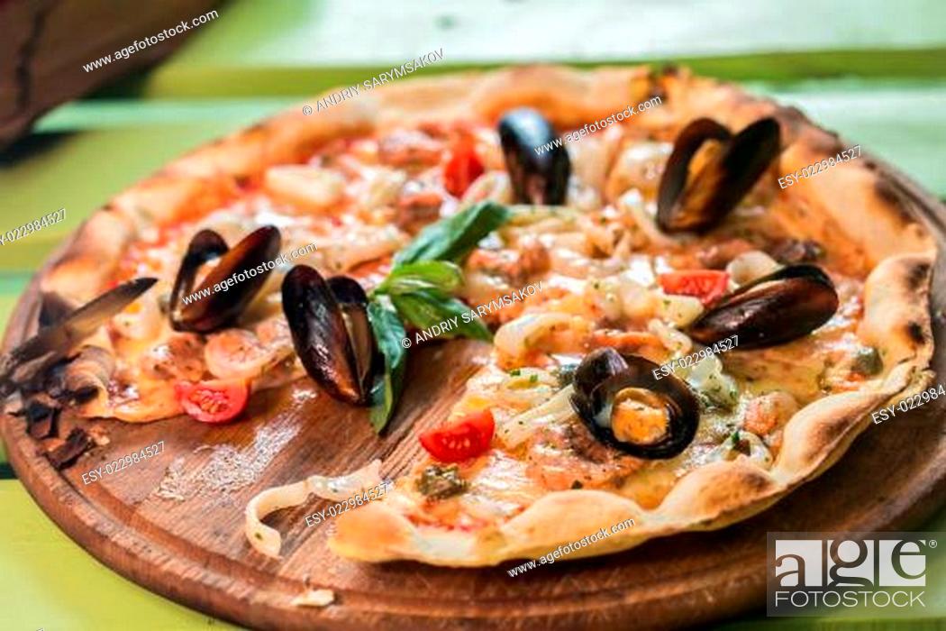 Stock Photo: Traditional italian seafood pizza.