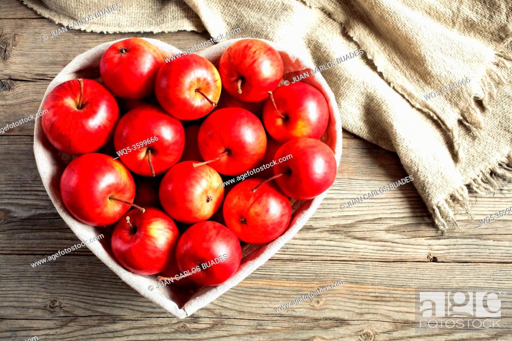 Stock Photo: Red apples on a table.