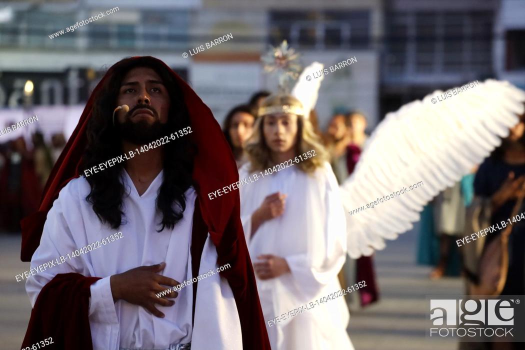 Stock Photo: MEXICO CITY, MEXICO - APR 14, 2022: A Faithful disguised as Jesus takes part perform on ""Holy Thursday"" at the 179th representation of the Passion of Christ.