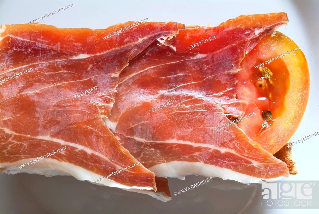 Stock Photo: Iberico ham sandwich and tomato.