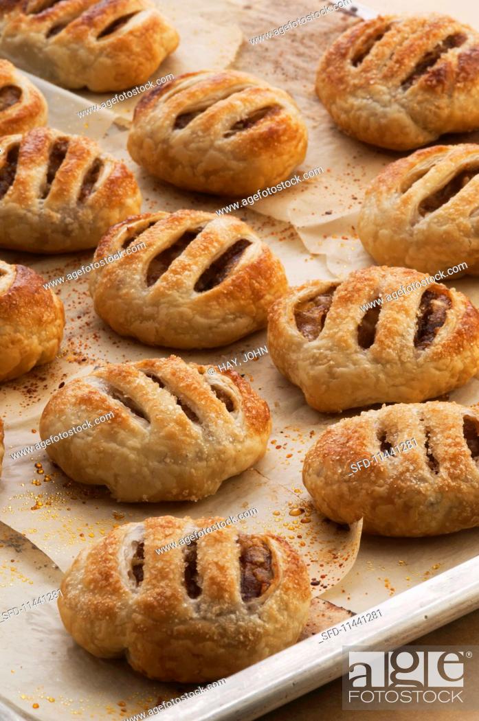 Stock Photo: Apple turnovers with dates and spices.