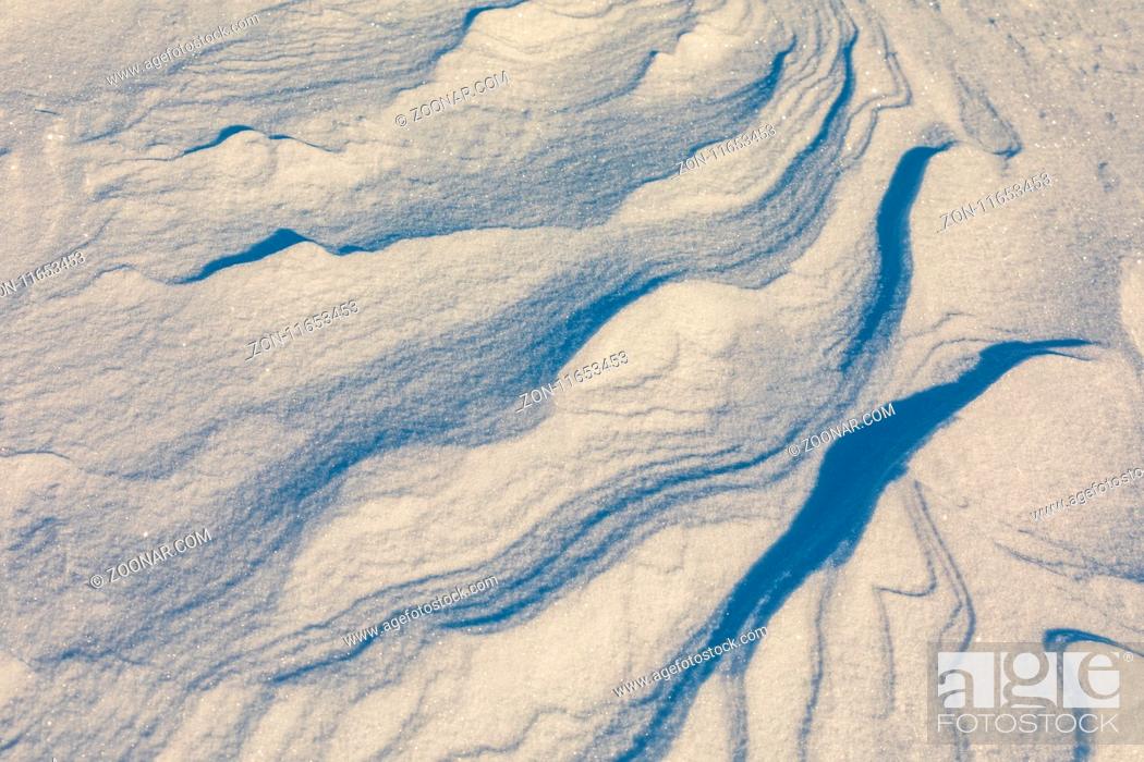 Stock Photo: Abstract shapes and pattern of wind in snow in the Norwegian mountains.