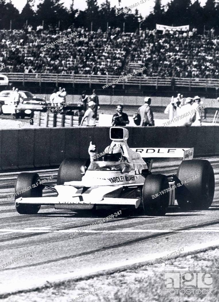 Stock Photo: Jun 01, 1973 - Smaland, Sweden - DENNY HULME crosses the finish line in a Mclaren to win the Swedish Grand Prix in Anderstorp. Exact date unknown.