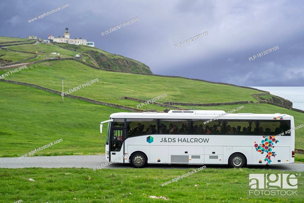Stock Photo: J&D S Halcrow bus driving tourists to Sumburgh Head Lighthouse at the southern tip of Mainland of Shetland, Scotland, UK.