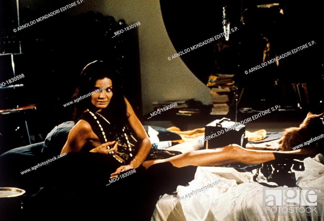 Stock Photo: Brazilian actress Florinda Bolkan (Florinda Soares Bulcao) lying on a bed in the film Investigation of a Citizen Above Suspicion. 1970.