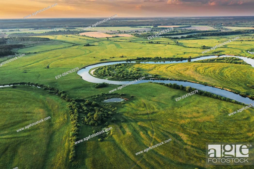 Stock Photo: Belarus. Aerial View Of Green Forest, Meadow And River Landscape In Sunny Evening. Top View Of European Nature From High Attitude In Summer Sunrise.
