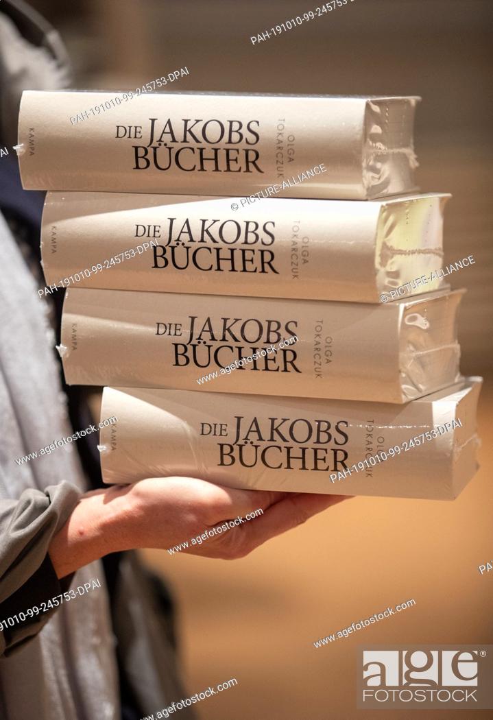 Stock Photo: 10 October 2019, North Rhine-Westphalia, Bielefeld: Works of ""The Jacob's Books"" by the Polish author Olga Tokarczuk are kept in piles.