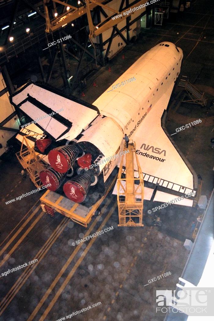 Stock Photo: 12/12/1997 --- The orbiter Endeavour awaits further processing in the transfer aisle of the Vehicle Assembly Building VAB.