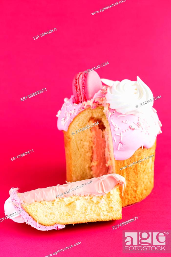 Stock Photo: Easter Cake - Russian and Ukrainian Traditional Kulich decorated with macarons and marshmallows on crimson red background. Paska Easter Bread.