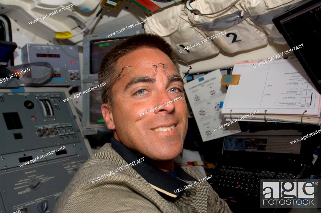 Stock Photo: Astronaut Christopher Cassidy, STS-127 mission specialist, on Endeavour's flight deck during flight day three.