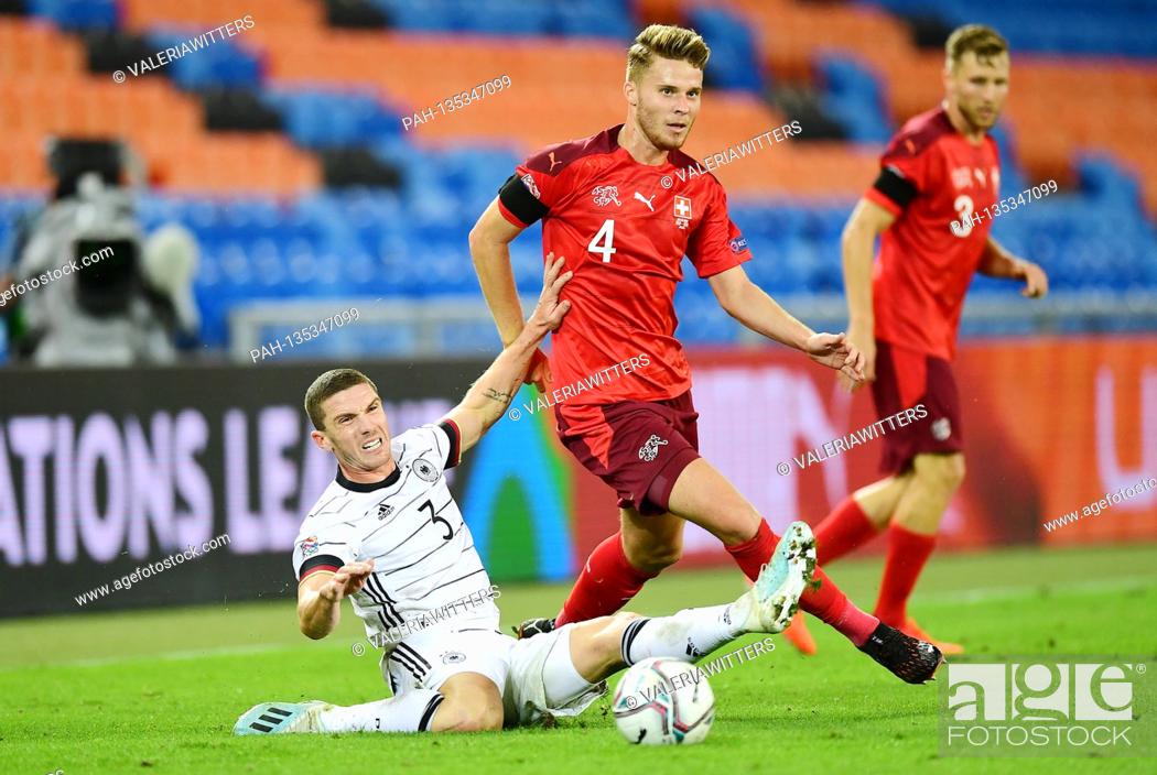 Stock Photo: firo Soccer: 06.09.2020 Switzerland - Germany Nations Cup left to right Robin Gosens (Germany), Nico Elvedi | usage worldwide. - Basel/Schweiz.