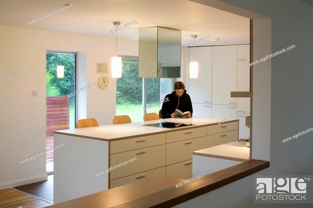 Stock Photo: extension, kitchen with figure. Architect: Paul Archer Design.