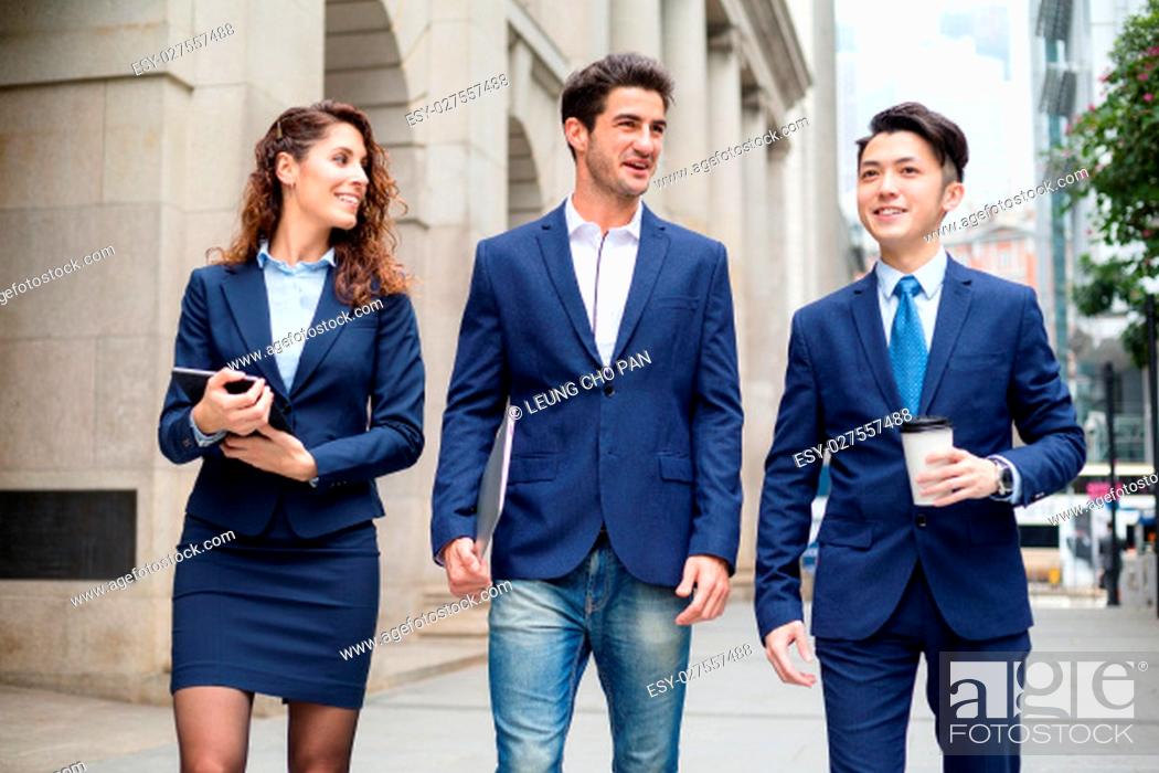 Stock Photo: Group of business people discuss at outdoor.