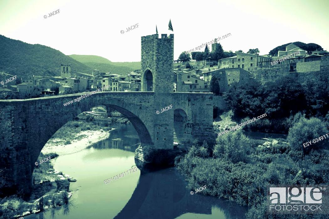 Stock Photo: Retro photo of medieval town with gate on bridge. Besalu, Catalonia.