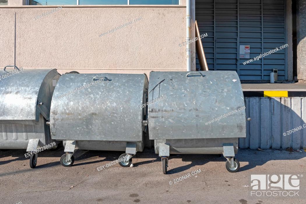 Stock Photo: Big Metal Industrial Waste Containers With Wheels.