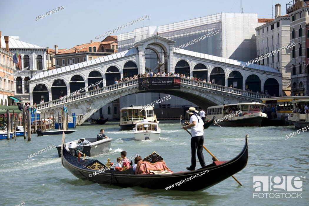 Stock Photo: The typical boats of Venice, the gondolas in Rialto bridge. Venice (italy), September 11th, 2016.