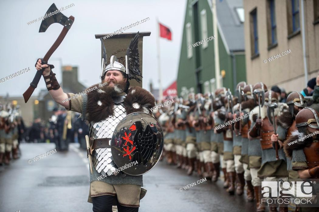 Stock Photo: The Guizer Jarl and his squad sing songs at the Lerwick Royal British Region to parade through the town of Lerwick, Shetland.
